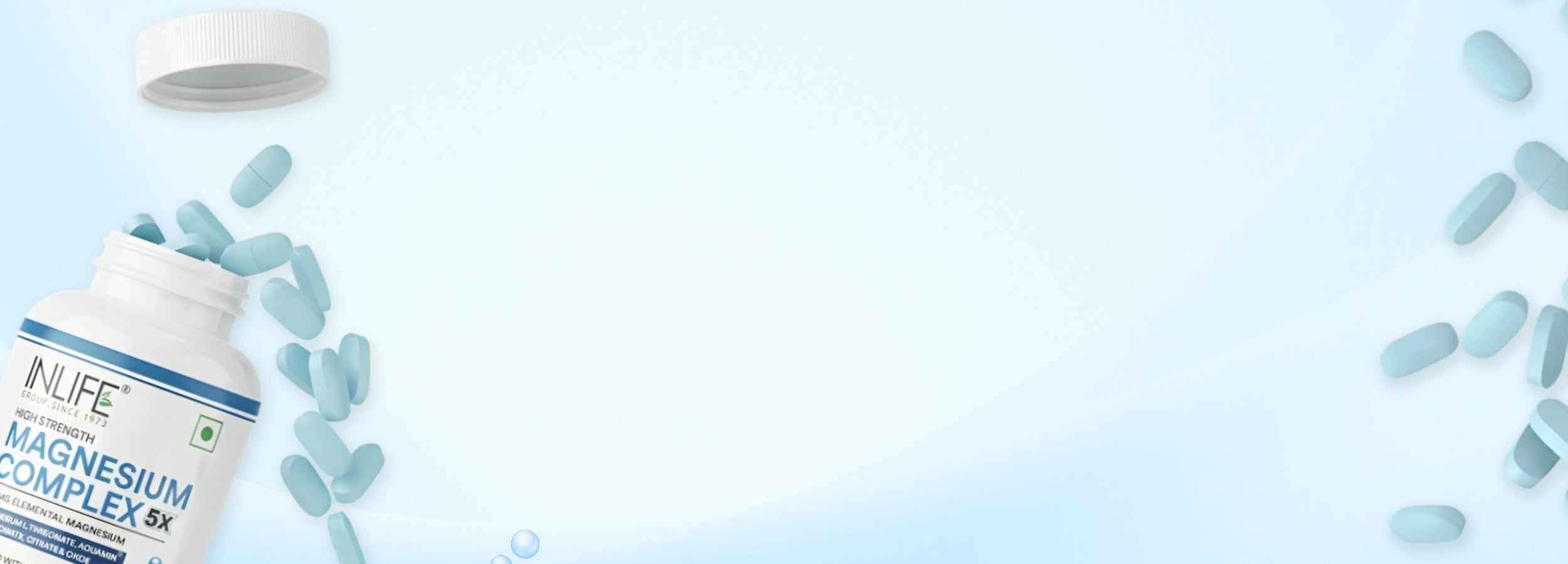 Close-up photo of the INLIFE Magnesium Complex 5X bottle with light blue capsules spilling out, emphasizing high-quality ingredients and manufacturing in a GMP-certified facility